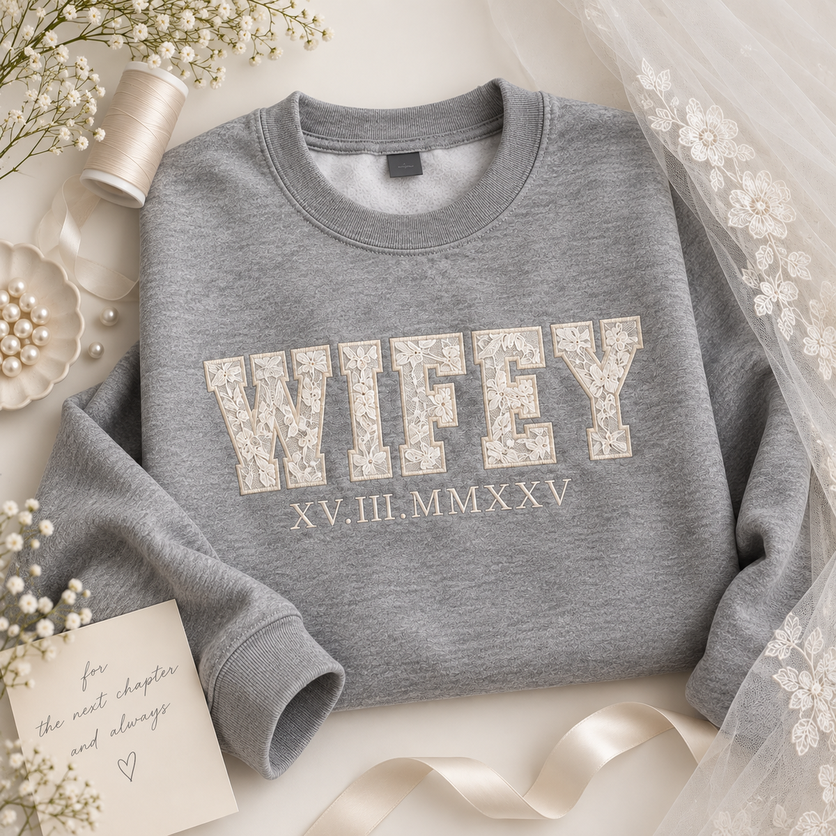 A heather gray crewneck sweatshirt with 'WIFEY' and 'XV.III.